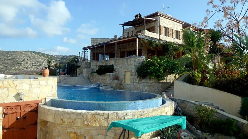 Natural-stone villa with an infinity-edge pool overlooking the hills near Polis Chrysochous